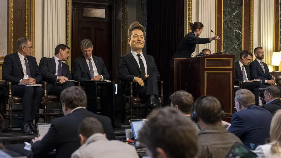 Executives and officials seated beside a podium with gilded trim at a Washington science summit, as photographed by a news photographer.